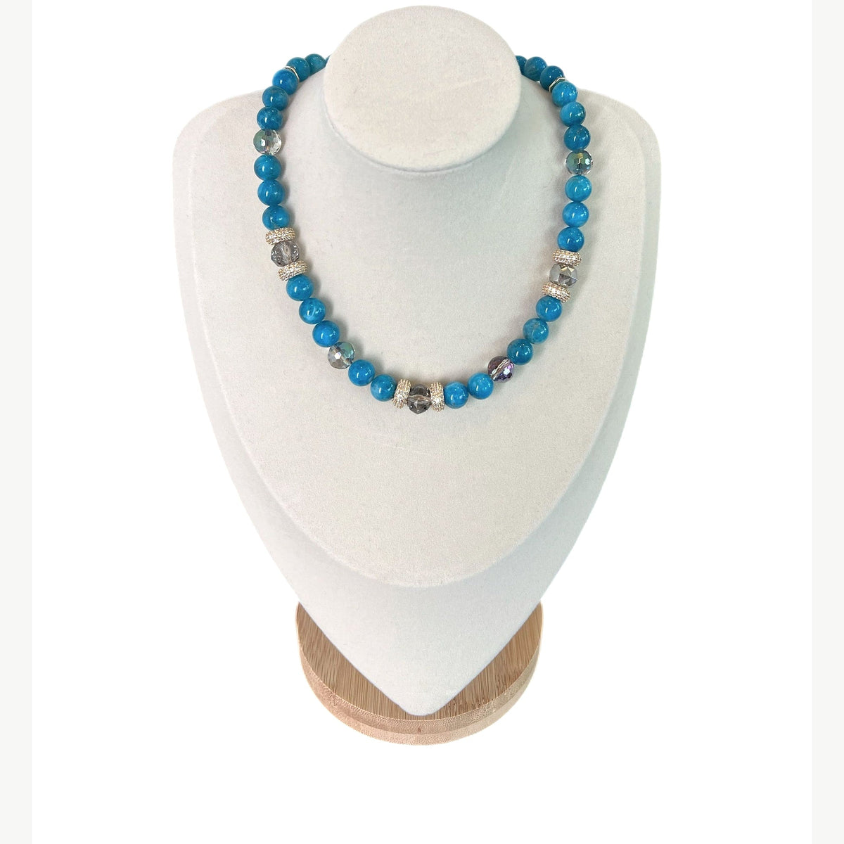 The Carina Necklace on a display bust: bright blue apatite with faceted grey Austrian crystals and gold pavé rondelles