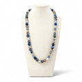 The Carolina Necklace on a display bust: a long strand of blue, grey and brown agate with gold pavé beads