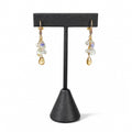 Citrine & Clear Crystal Drop Earrings on a dark earring stand: a cascade of clear crystals above a faceted citrine drop, gold throughout