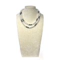 The Marilyn Necklace on a display bust: a long double strand of luminous white glass pearls with plated hematite rondelles