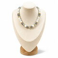 The Martha Necklace: moonstone, gray glass pearls and clear Austrian crystals with gold rondelles, on a cream display bust