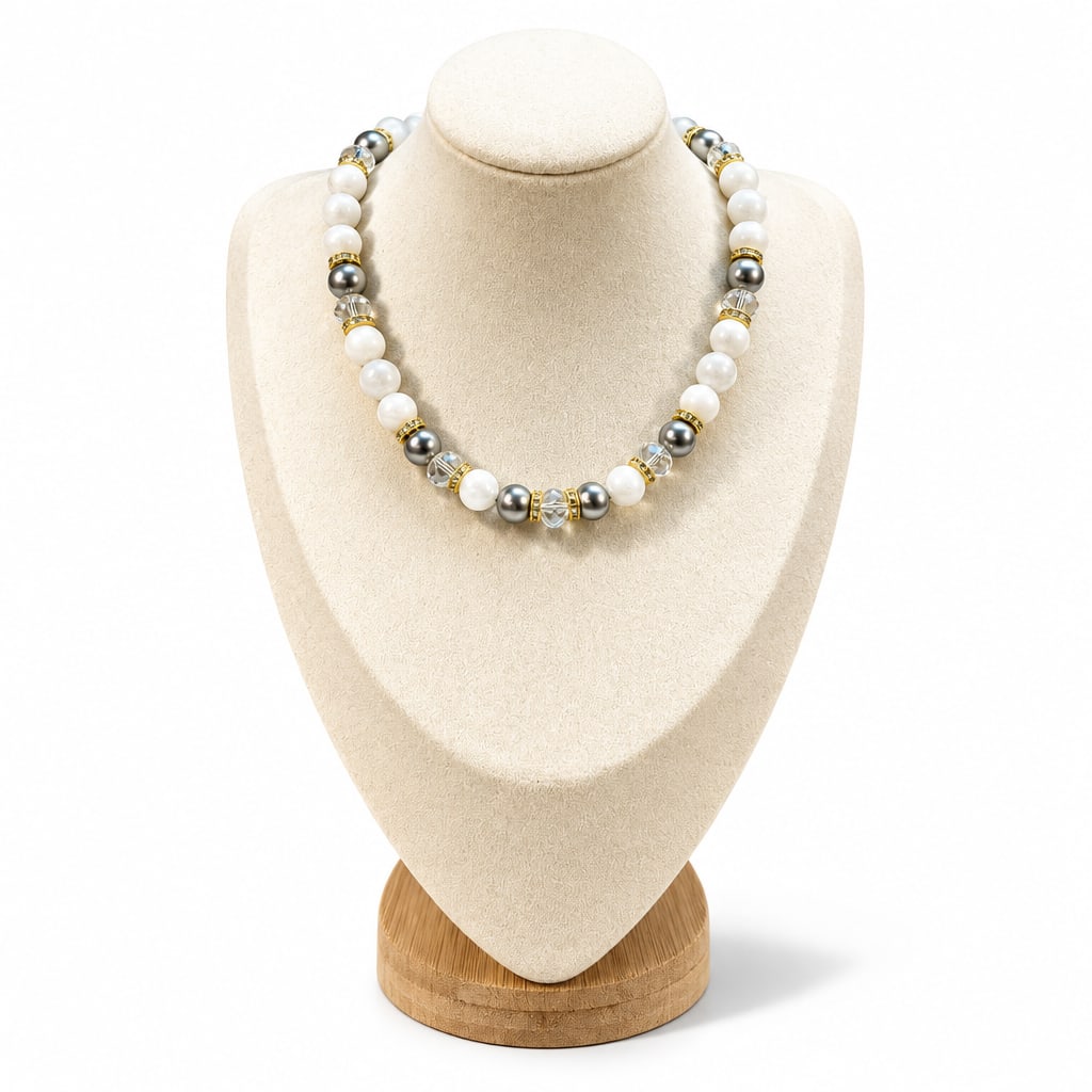 The Martha Necklace: moonstone, gray glass pearls and clear Austrian crystals with gold rondelles, on a cream display bust