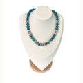 The Melania Necklace on a display bust: teal blue apatite with faceted Austrian crystals and gold pavé rondelles